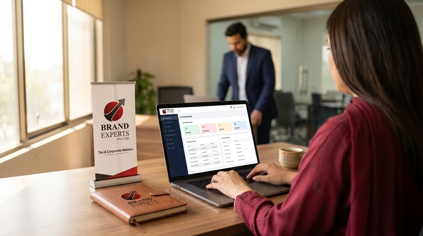 Client reviewing the BE Tax dashboard on a laptop